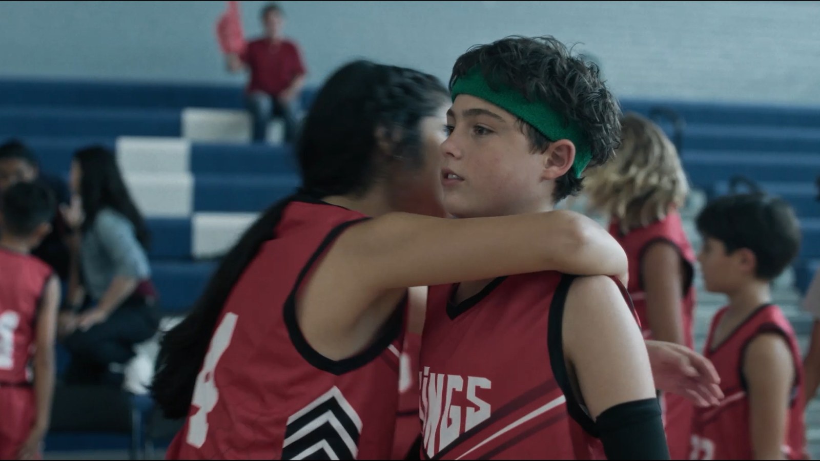 Last Shot — Caden embraced by a teammate after the buzzer