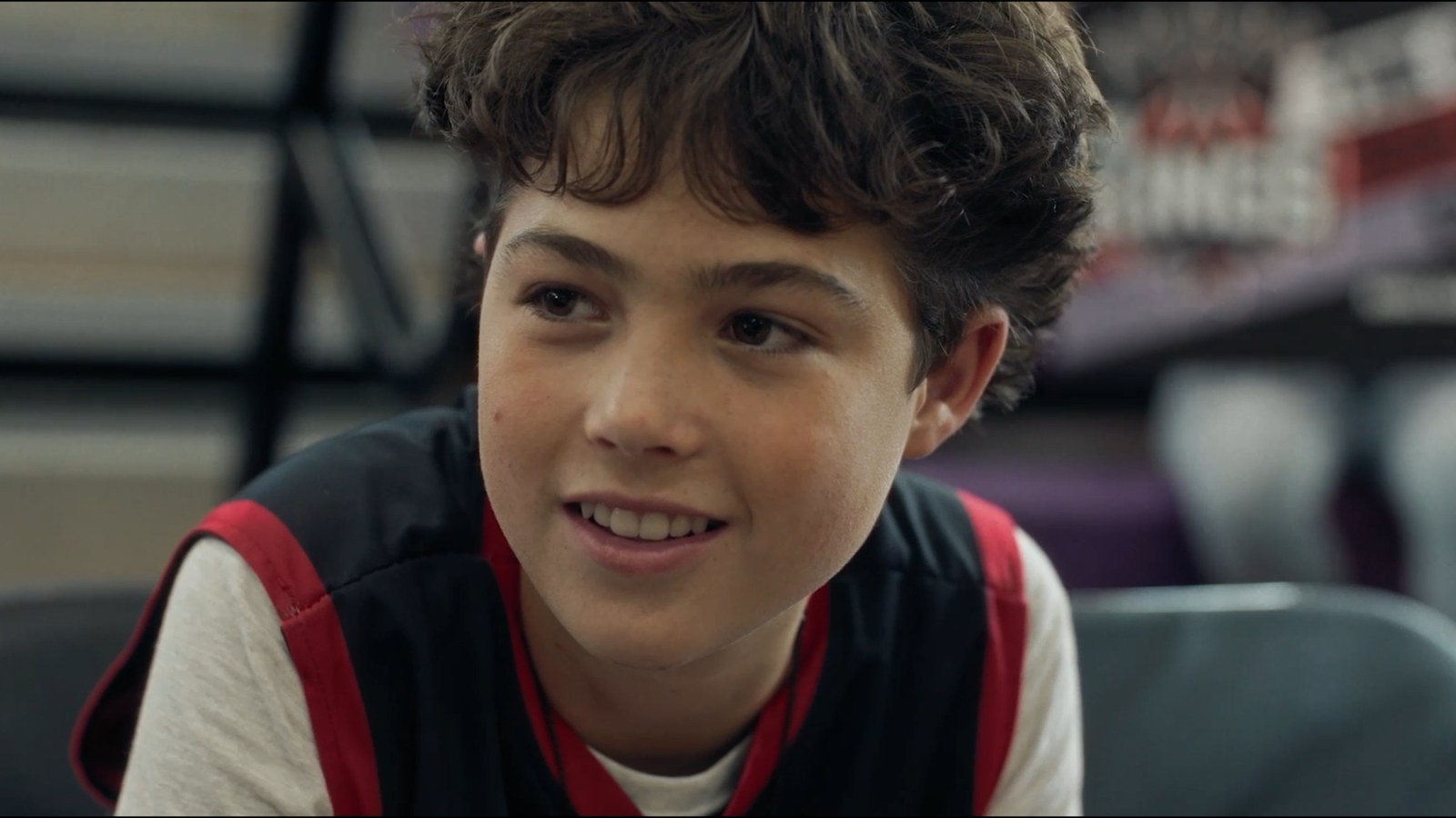 Last Shot — Caden grinning on the bench